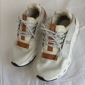 On Running Cream and Brown Sneakers